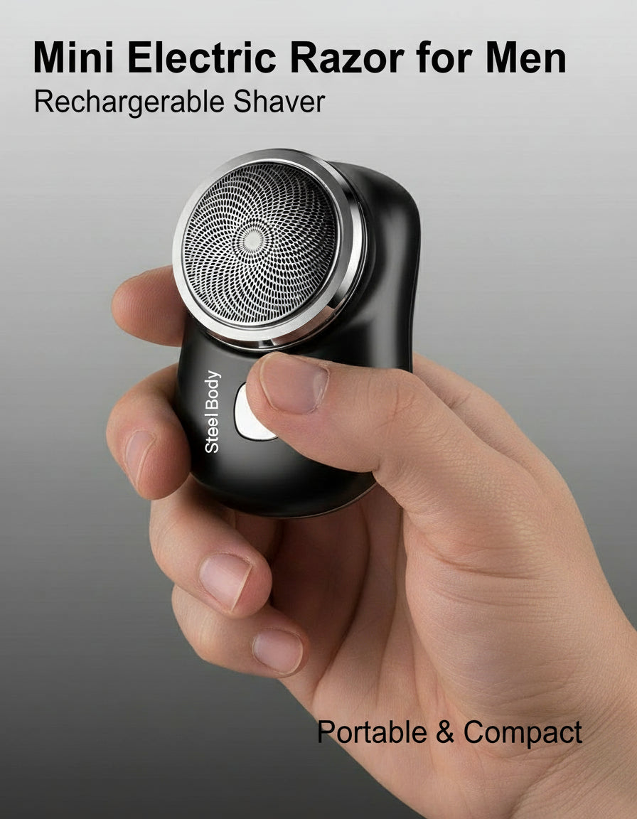 Hand holding a black electric shaver against a gray background