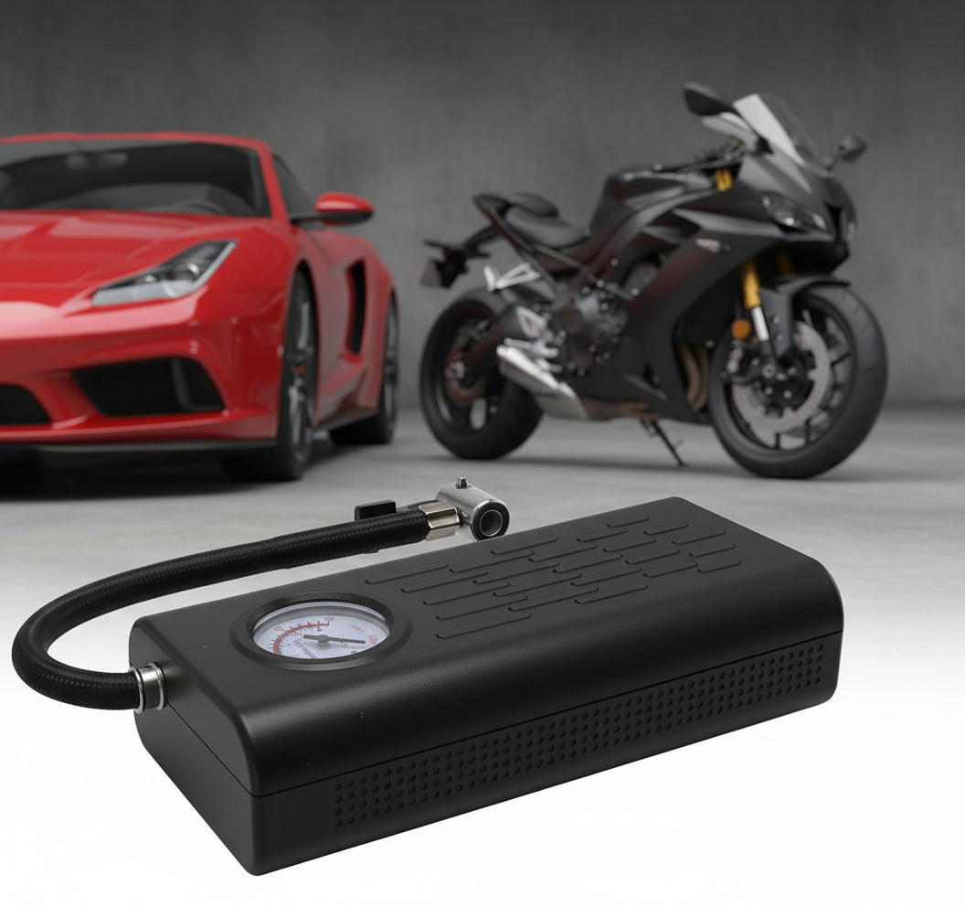 Black portable air compressor with a pressure gauge on a white background